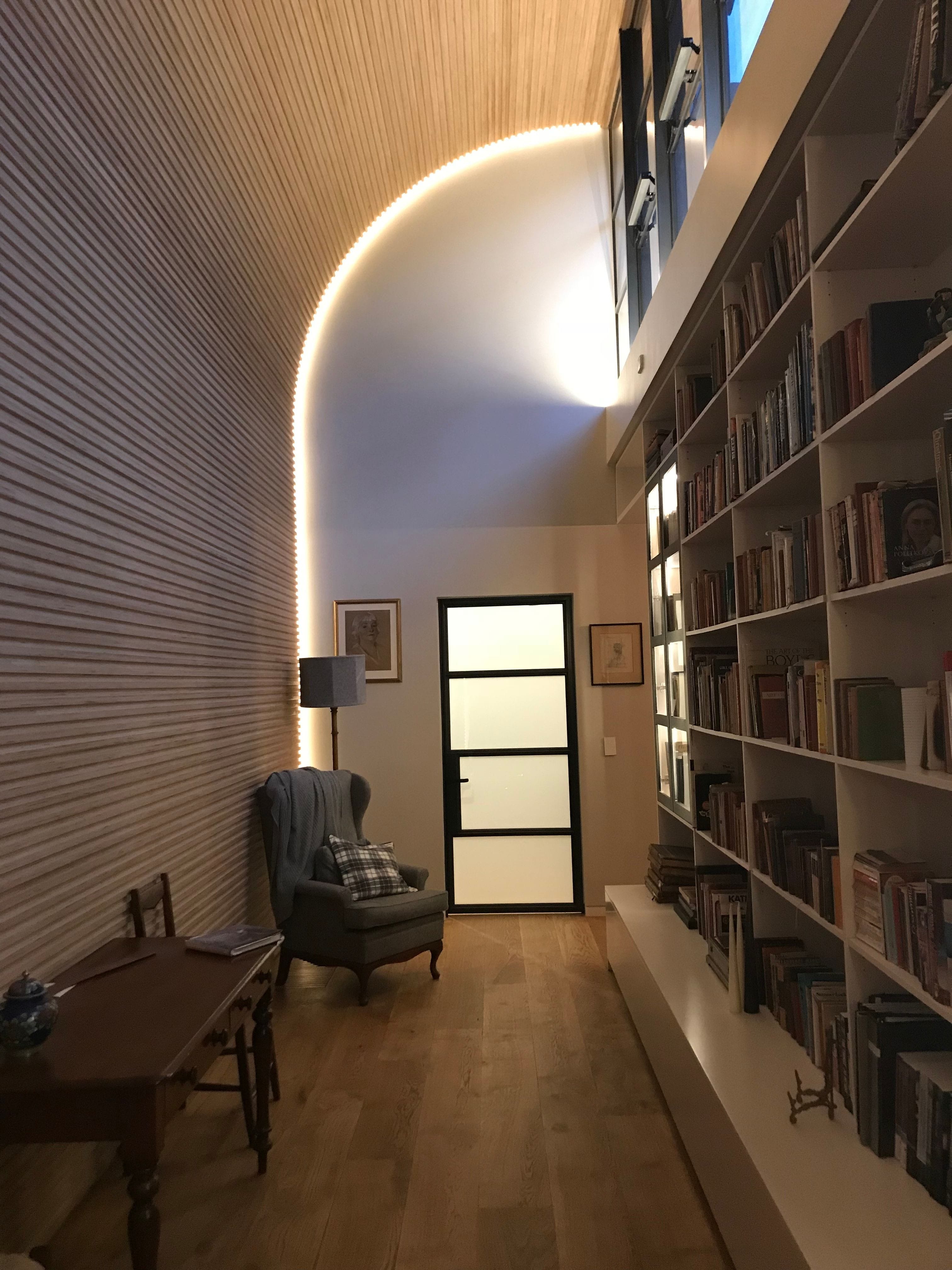 An example of a domestic lighting installation in a small personal library.